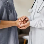 Primary care provider offering compassionate support and personalized care to a patient at a primary care clinic in Jacksonville.
