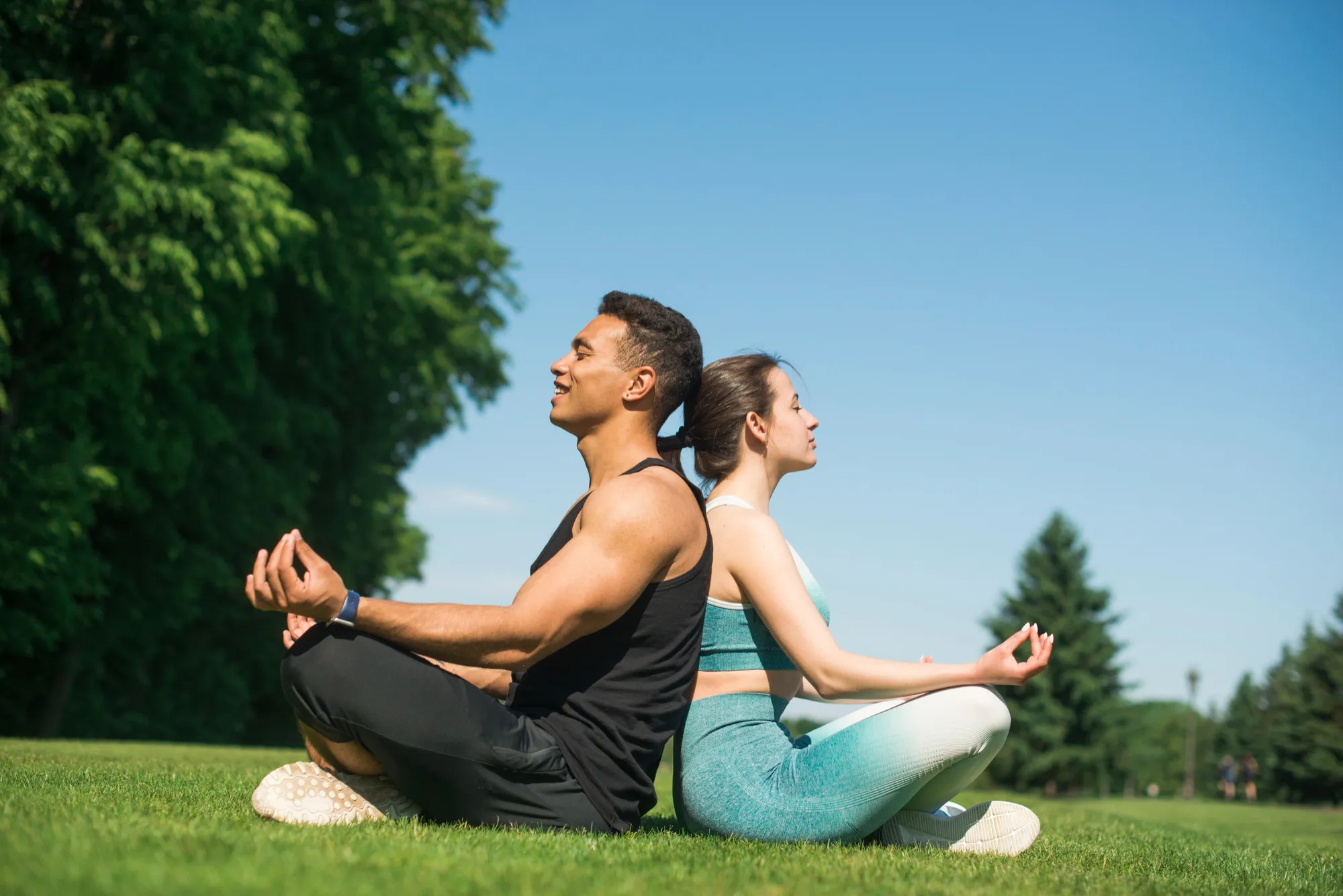 Couple practicing outdoor meditation as part of a healthy lifestyle at a wellness center in Jacksonville.