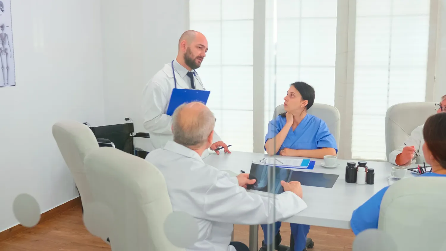 Healthcare professionals discussing patient care for Total Care Clinic in Jacksonville FL.