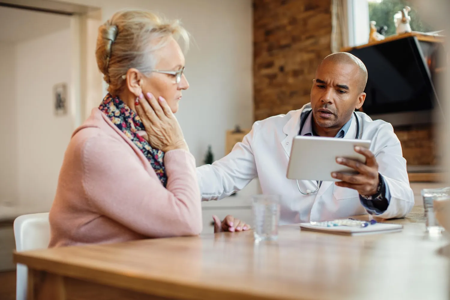 Jacksonville primary care doctor reviewing treatment options with a senior patient during a consultation at a trusted primary care clinic in Jacksonville.