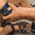 Healthcare professional assisting an injured child with a wrist brace after an accident, highlighting injury care and personal injury specialists in Jacksonville