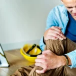 Healthcare professional assisting a patient with crutches at one of the injury care centers in Jacksonville, providing evaluation, treatment, and recovery support after a work-related injury.