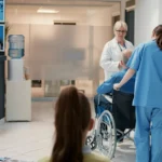 Healthcare staff assisting patient in wheelchair at walk in clinic Jacksonville FL providing urgent care and patient care services