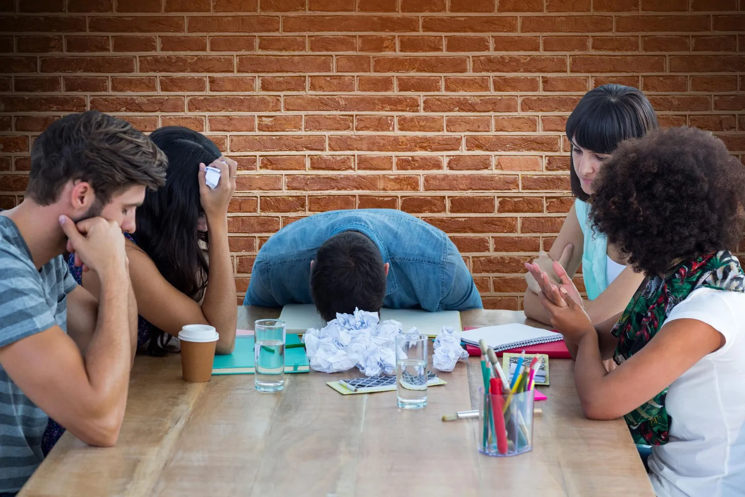 Group of distressed young adults in a support setting, highlighting the importance of alcohol detox Jacksonville and professional Substance abuse Jacksonville recovery support systems