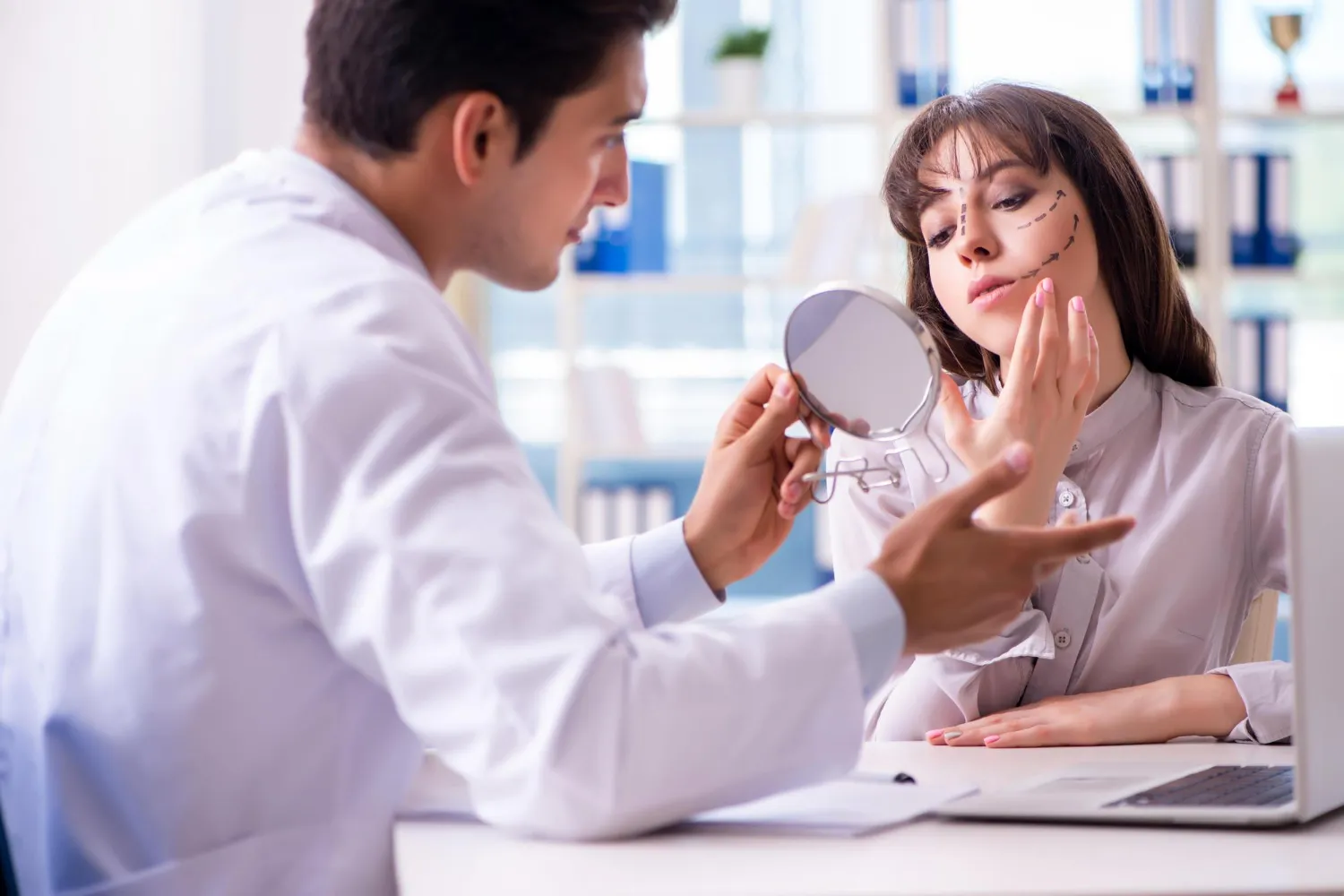dermatologists in Jacksonville FL consulting patient about facial treatment options at professional skincare center Jacksonville