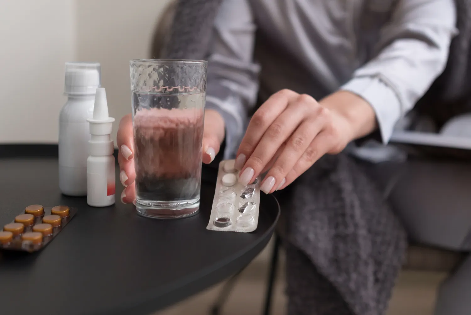 Person taking prescribed medication for recovery during substance abuse treatment at addiction treatment center in Jacksonville FL