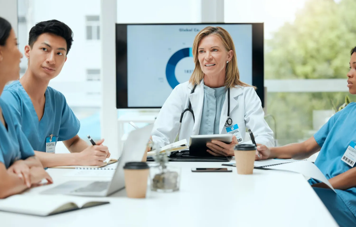 Primary care physicians discussing patient care and treatment planning at a primary care center