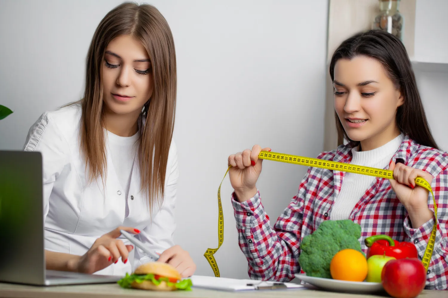 Nutrition consultation focused on weight loss planning with healthy food and measurements guided by obesity specialists in Jacksonville