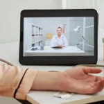 Patient checking vitals at home during a video consultation, representing a convenient digital doctor visit through a modern online health clinic