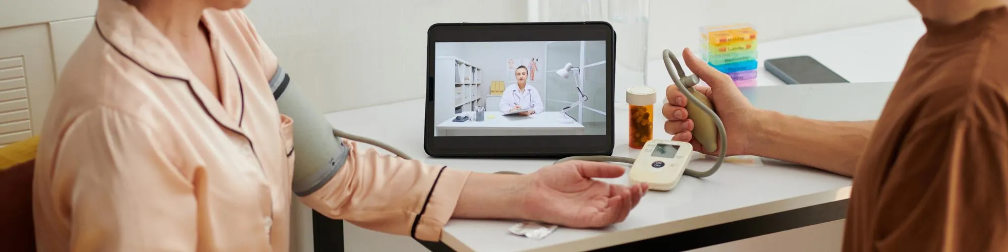 Patient checking vitals at home during a video consultation, representing a convenient digital doctor visit through a modern online health clinic