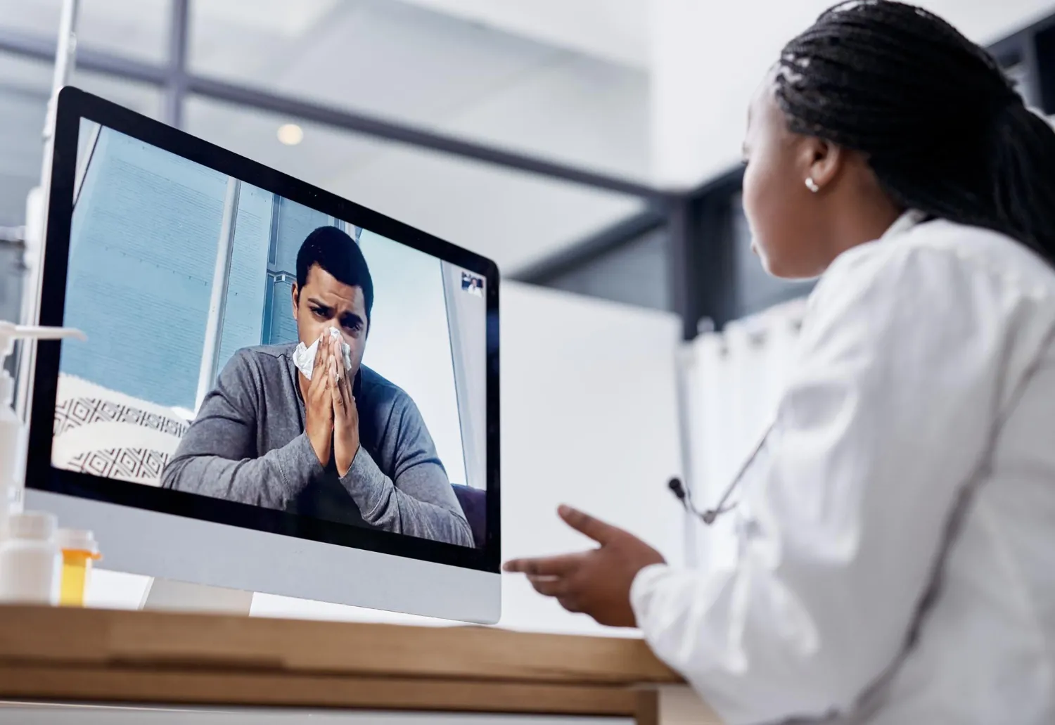 Doctor consulting a patient via video call on a desktop, highlighting accessible virtual doctors in Jacksonville and seamless online medical appointments