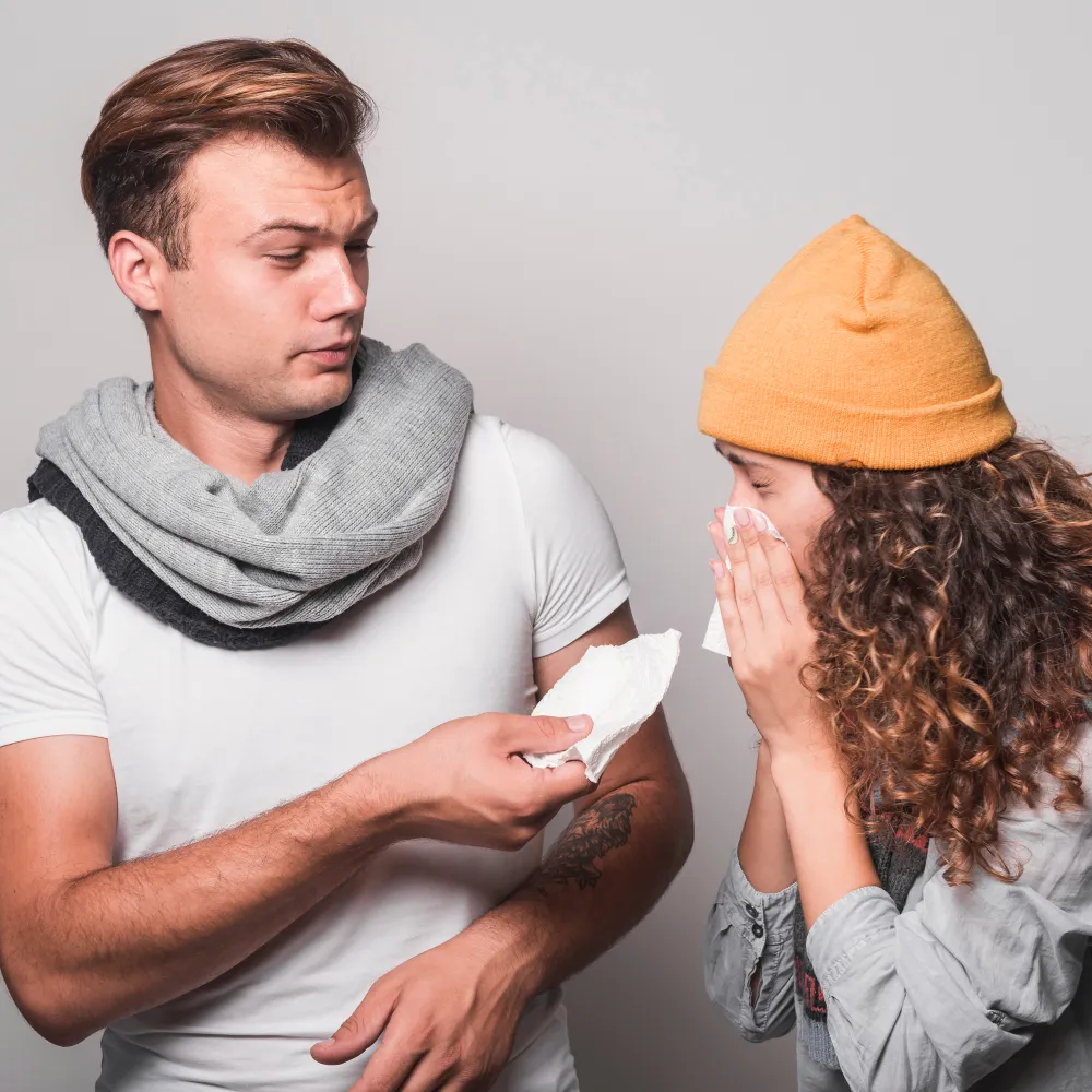 Person showing concern while another offers support with tissues, symbolizing the importance of timely STD test, emotional support, and access to a trusted STD testing center for early diagnosis and care