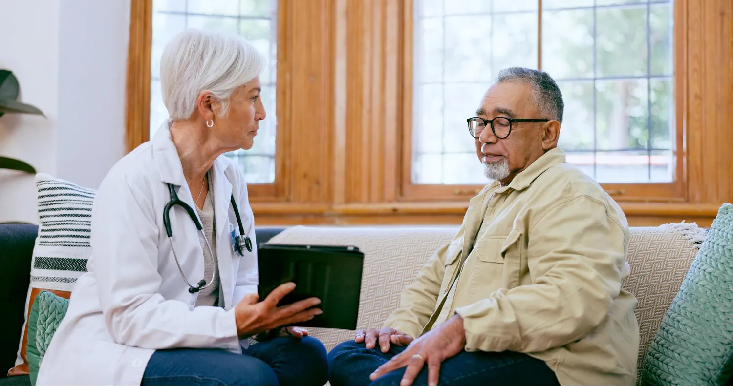 Geriatric doctor providing elderly patient care consultation at home for senior health management in Jacksonville FL