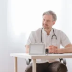 Internist in Jacksonville consulting with a child and parent during a routine medical visit, highlighting comprehensive family healthcare, preventive care, and personalized treatment for all ages.