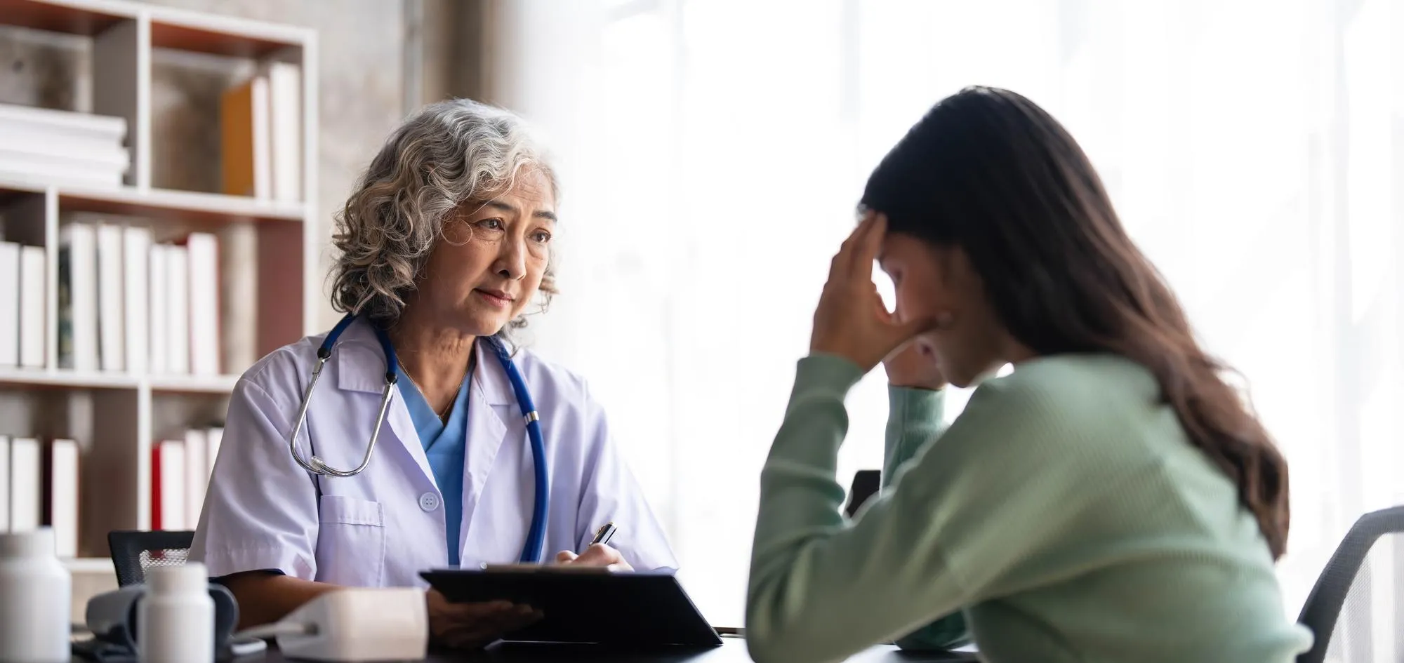 Internist in Jacksonville consulting with a child and parent during a routine medical visit, highlighting comprehensive family healthcare, preventive care, and personalized treatment for all ages.