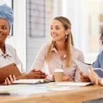 Group of women participating in a supportive wellness discussion, representing women's primary care focused on preventive health, education, and personalized care.