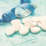 Tirzepatide vs semaglutide weight loss medications with a measuring tape and pills, illustrating options for weight management treatment.
