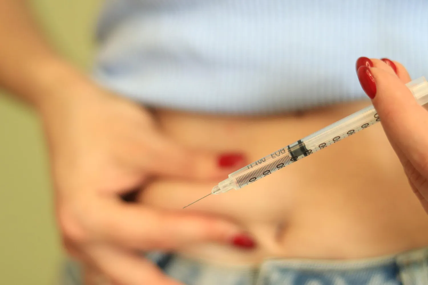 Close-up of a semaglutide injection prepared for abdominal administration as part of a medically supervised weight loss injection program using GLP-1 weight loss medication.
