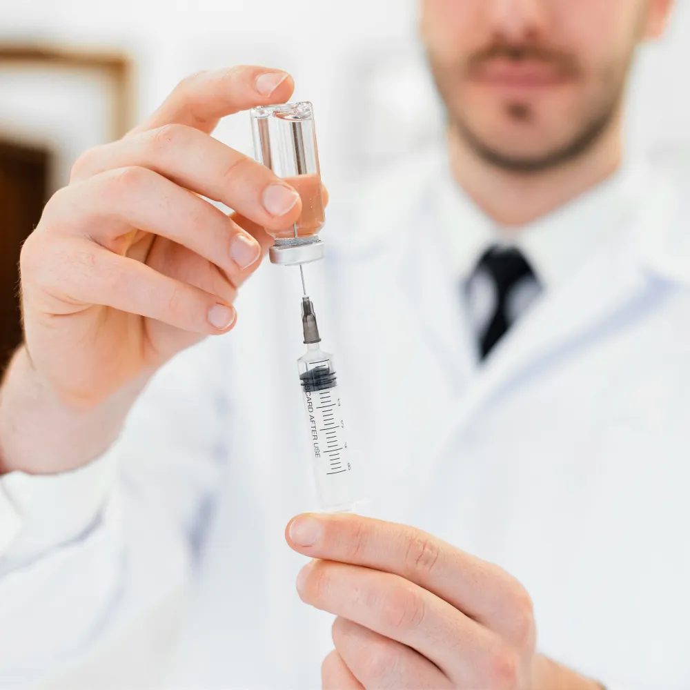 Healthcare professional preparing a semaglutide injection from a medication vial for medical weight loss treatment using GLP-1 weight loss medication, including Ozempic for weight loss when clinically appropriate.