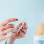 Healthcare professional preparing an IV injection for a patient receiving Infusion Treatments In Jacksonville.