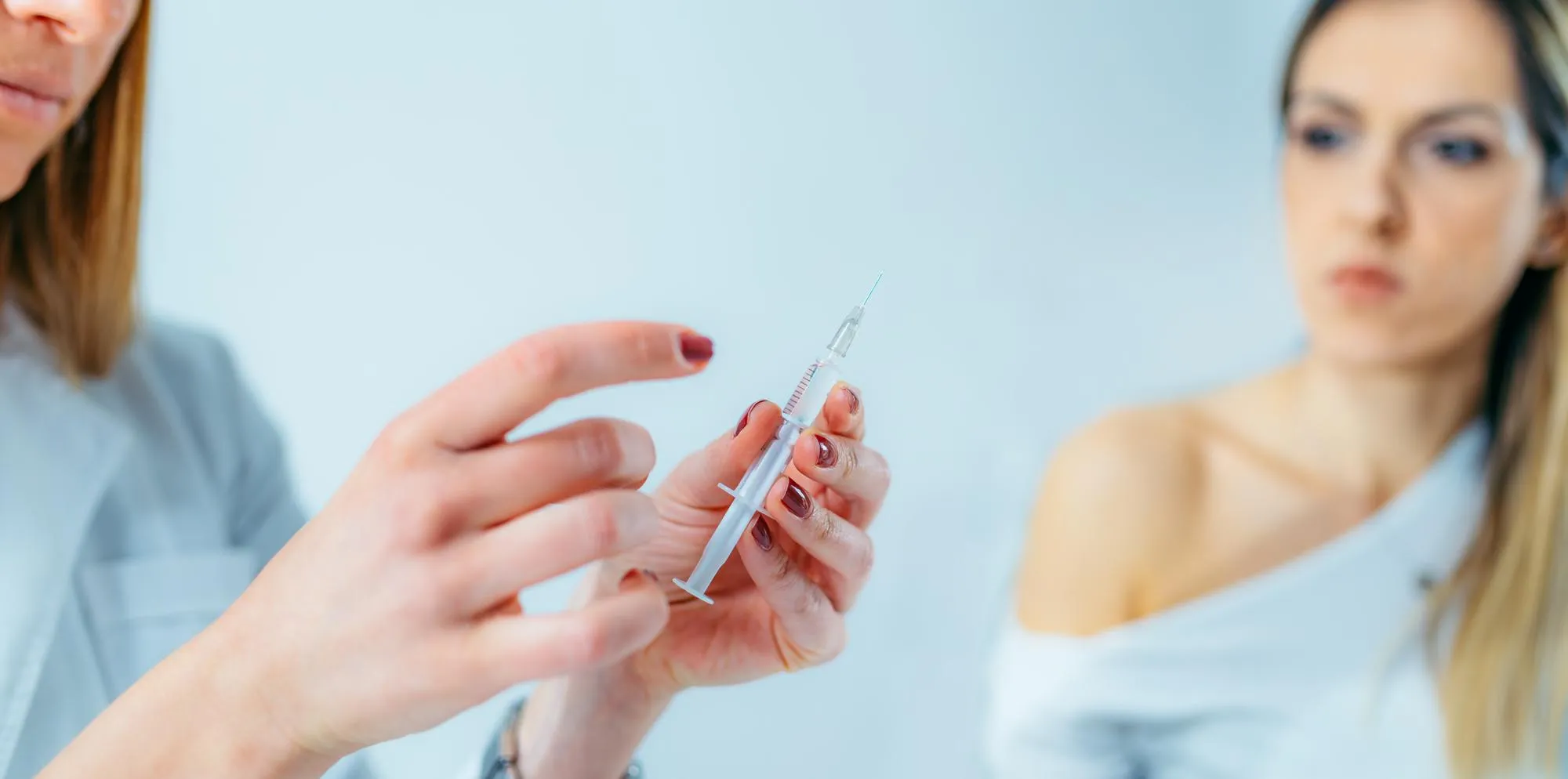 Healthcare professional preparing an IV injection for a patient receiving Infusion Treatments In Jacksonville.