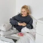Woman resting at home while experiencing possible STD symptoms.