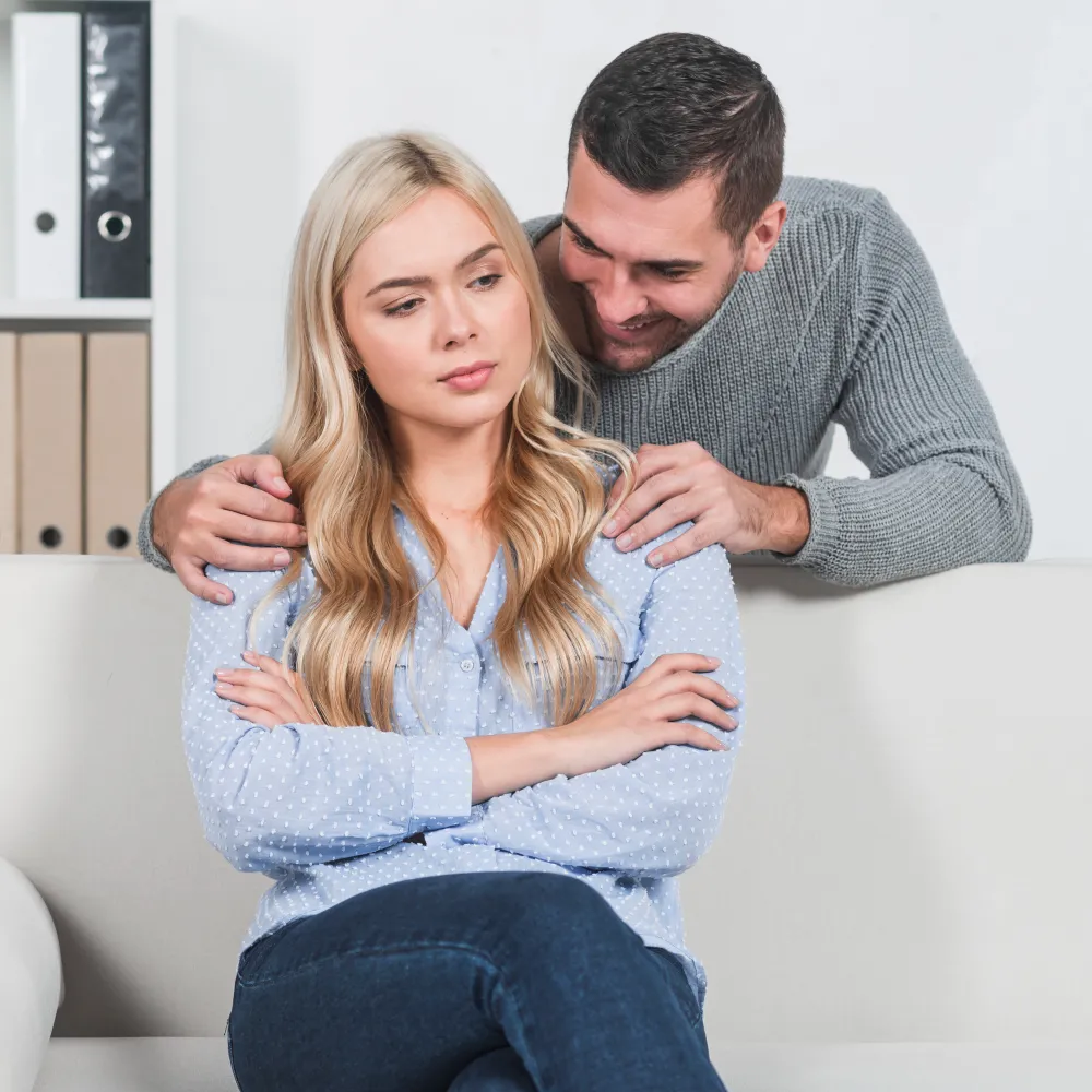Couple experiencing possible STD symptoms at home.