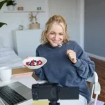 Woman participating in an online health consultation from home with support from a mental health clinic.