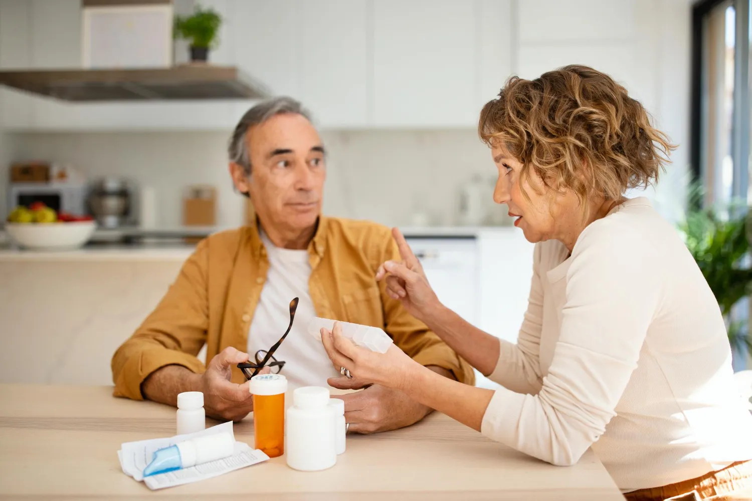 Adult discussing medication and health concerns with a caregiver as part of adult eating disorder treatment in Jacksonville.
